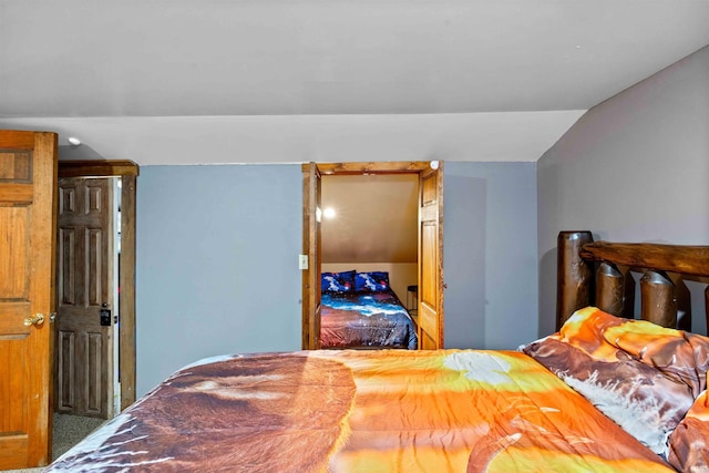 bedroom with lofted ceiling