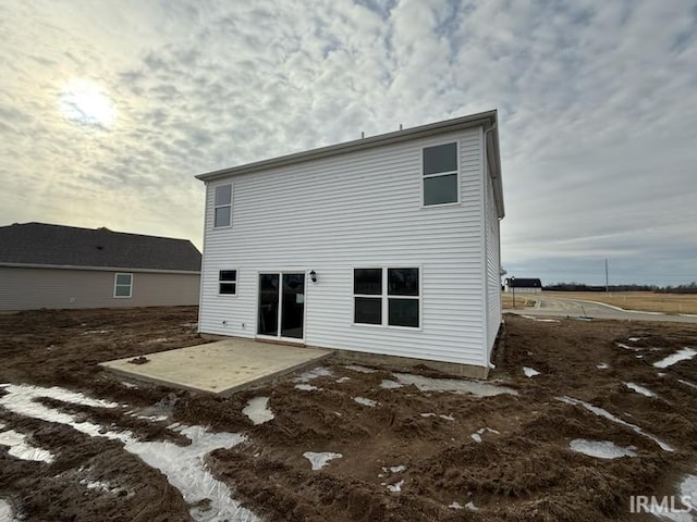 back of house with a patio