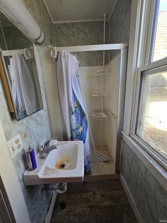 bathroom featuring sink and a shower with shower curtain