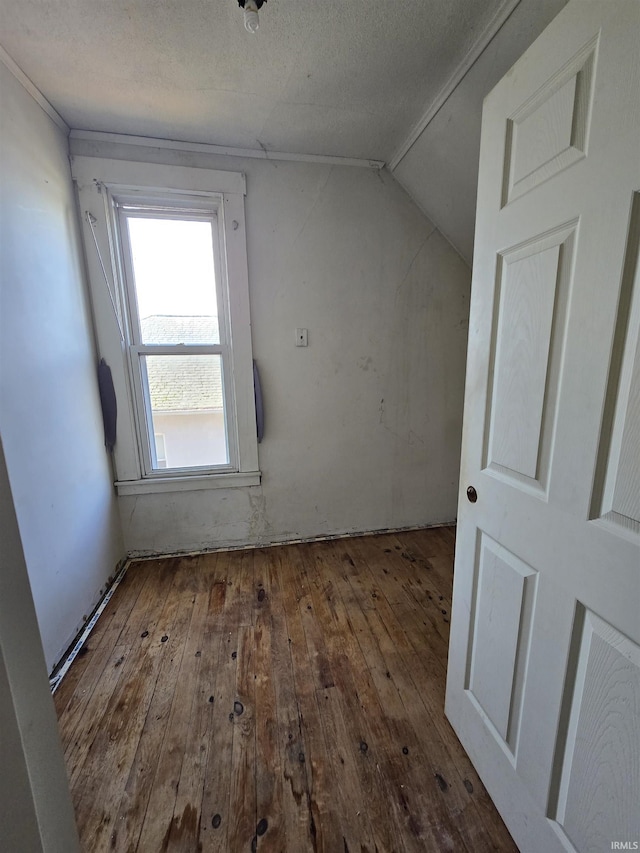 bonus room with vaulted ceiling and hardwood / wood-style floors