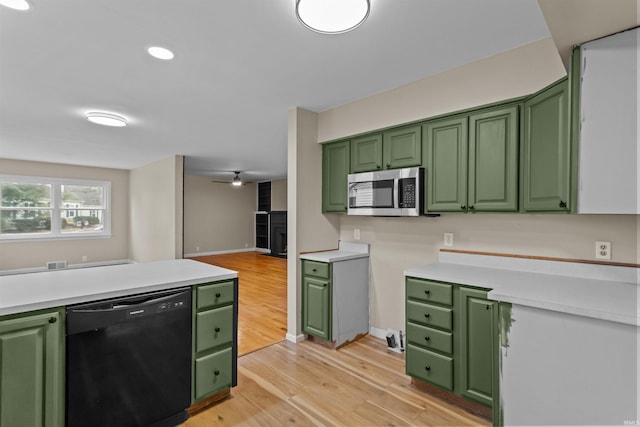 kitchen with dishwasher, ceiling fan, light hardwood / wood-style floors, and green cabinetry