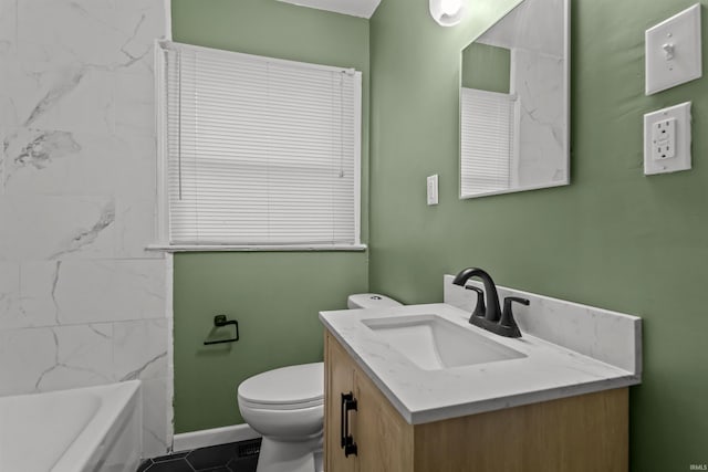 bathroom with vanity, tile patterned floors, and toilet