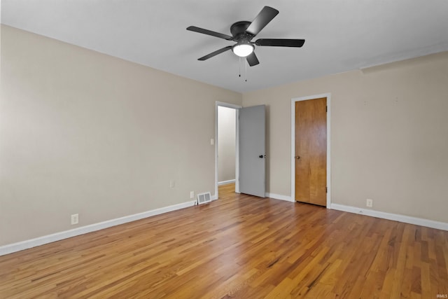 unfurnished bedroom with ceiling fan and light wood-type flooring