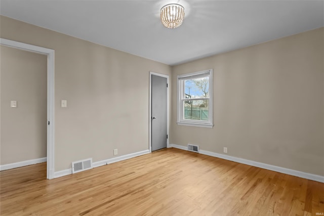 unfurnished room featuring light hardwood / wood-style floors