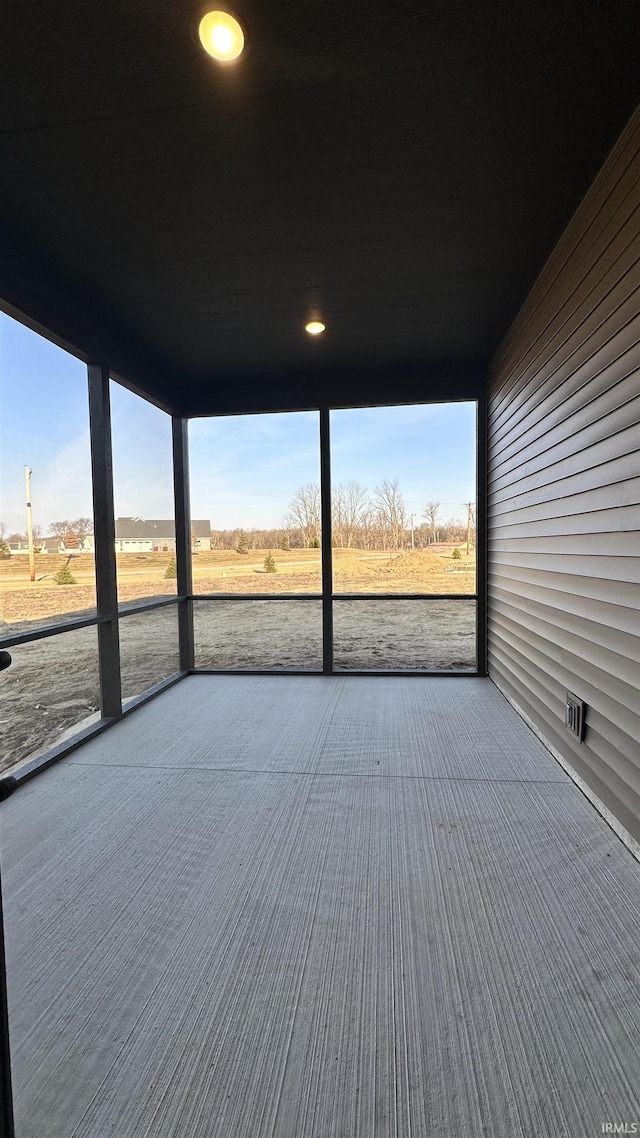 unfurnished sunroom featuring plenty of natural light