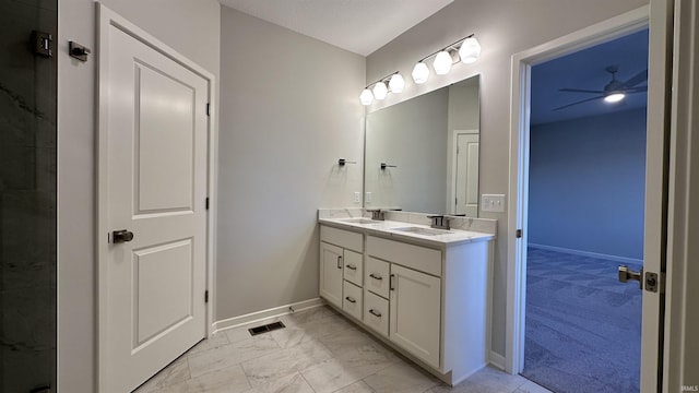 full bath with a sink, visible vents, marble finish floor, and double vanity