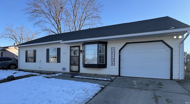 single story home featuring a garage