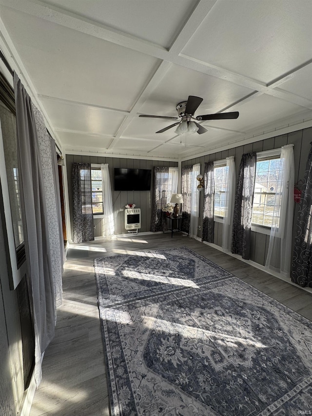 living room featuring coffered ceiling, hardwood / wood-style floors, ceiling fan, and heating unit