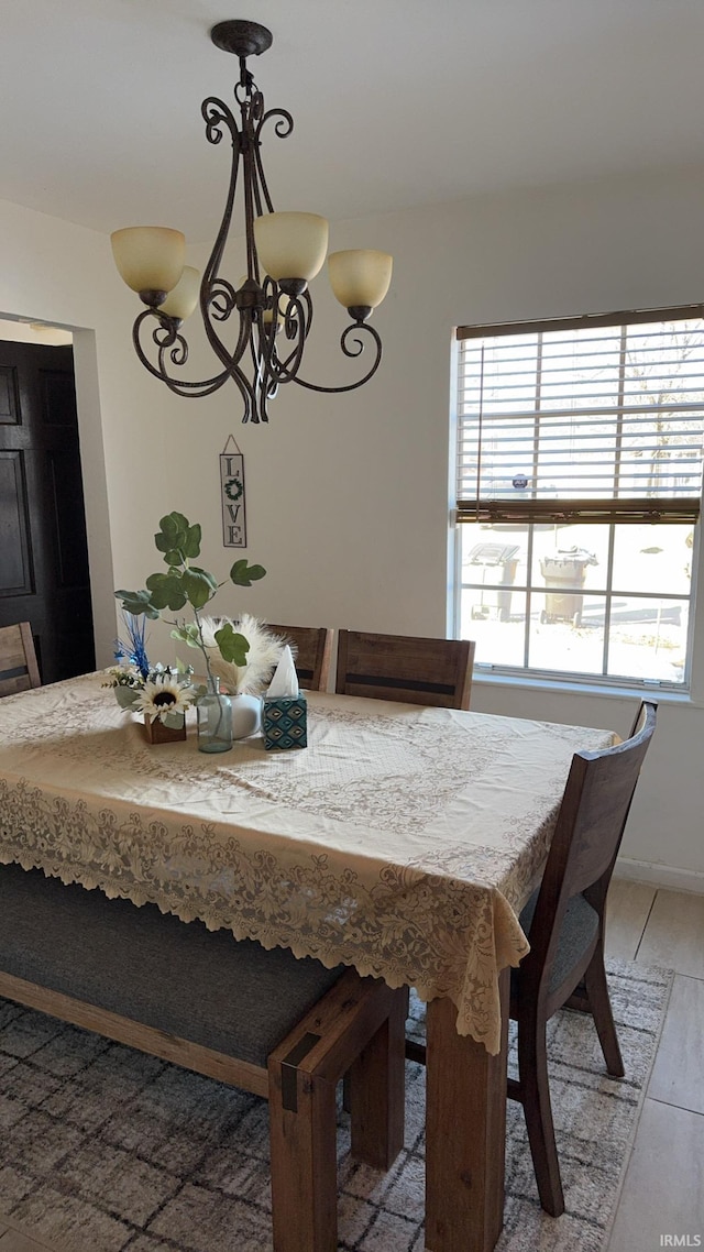 unfurnished dining area with an inviting chandelier