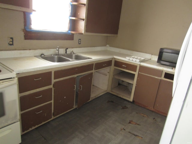 kitchen with sink and white range with electric cooktop