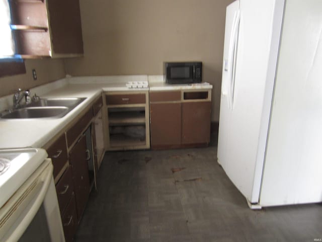 kitchen featuring sink, white refrigerator with ice dispenser, and dark hardwood / wood-style floors