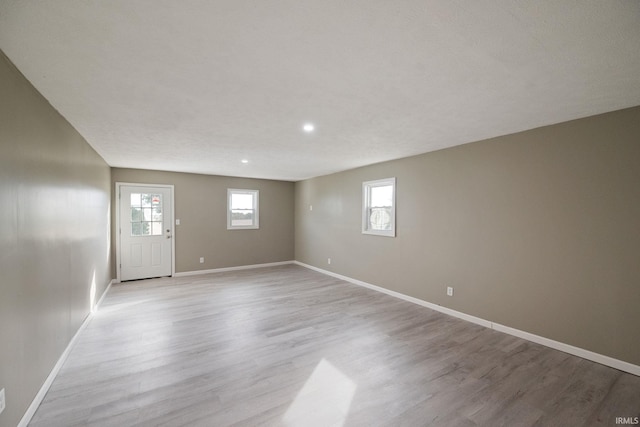 basement featuring light wood-type flooring