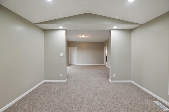 basement featuring light carpet