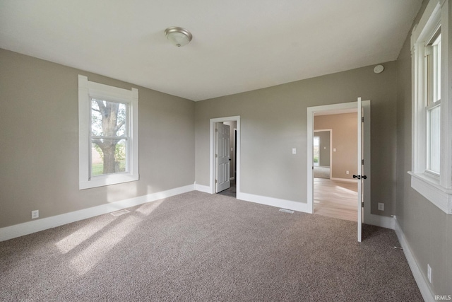 unfurnished bedroom featuring carpet