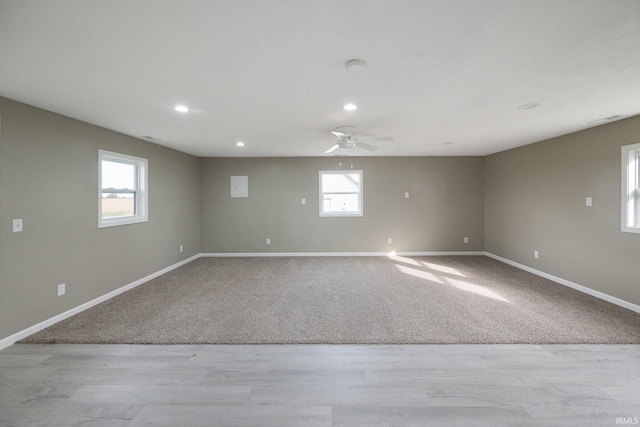 spare room with ceiling fan and light hardwood / wood-style flooring