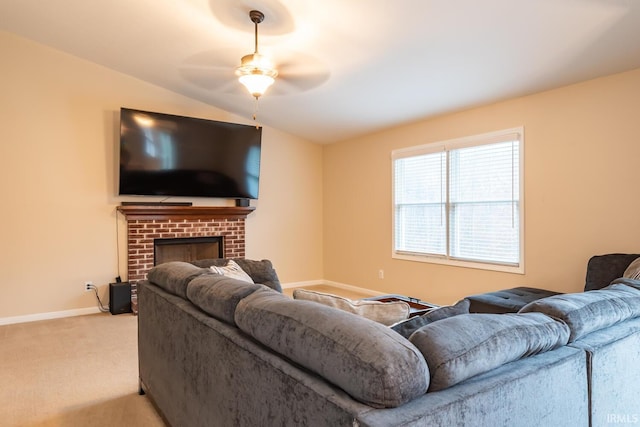 carpeted living room featuring ceiling fan and a fireplace