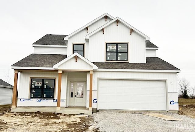 modern farmhouse style home featuring a porch and a garage