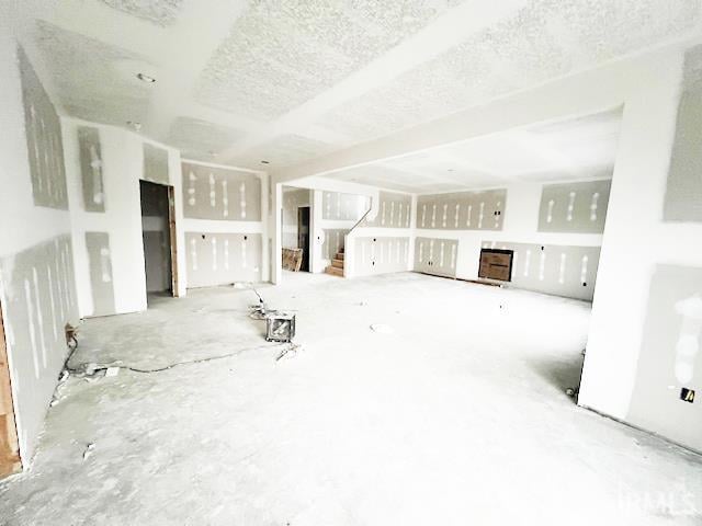 unfurnished living room featuring a textured ceiling