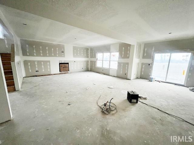 unfurnished living room featuring a textured ceiling