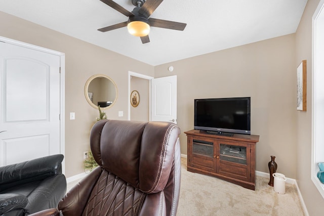 carpeted living room featuring ceiling fan