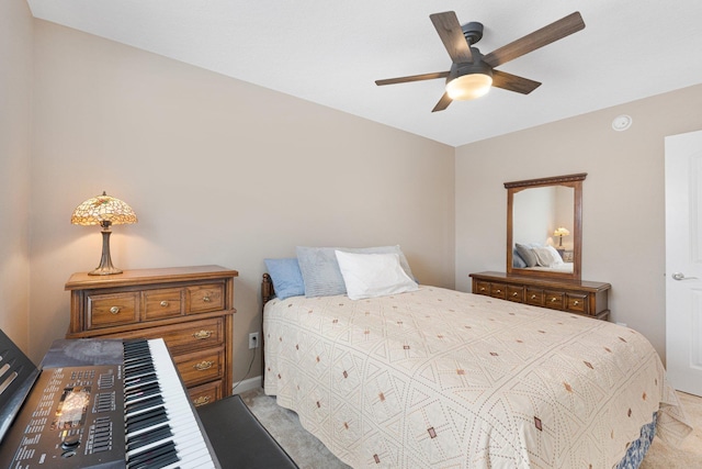 bedroom with light carpet and ceiling fan