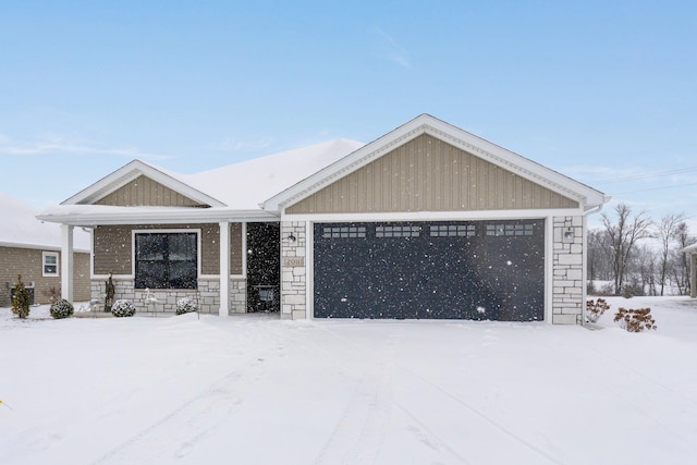 view of front of property with cooling unit and a garage