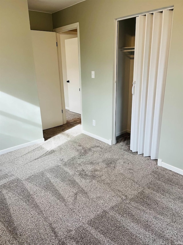 unfurnished bedroom featuring a closet and carpet