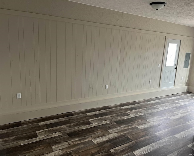 spare room featuring dark hardwood / wood-style flooring