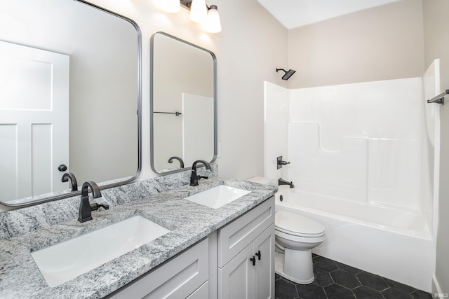 bathroom featuring toilet, a sink, bathing tub / shower combination, and tile patterned floors