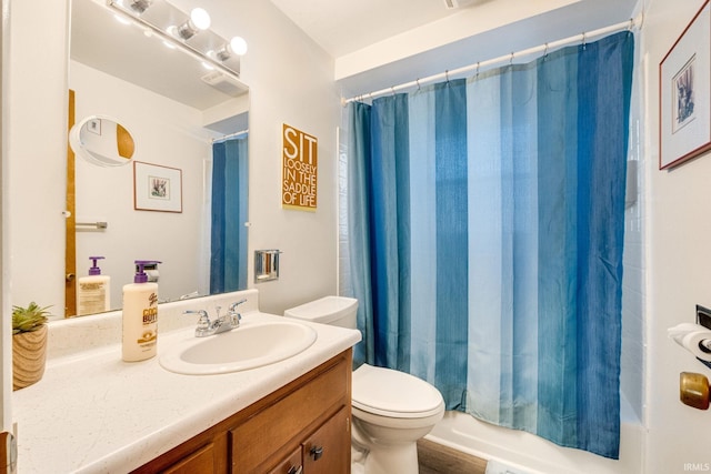 full bathroom with vanity, shower / bathtub combination with curtain, and toilet