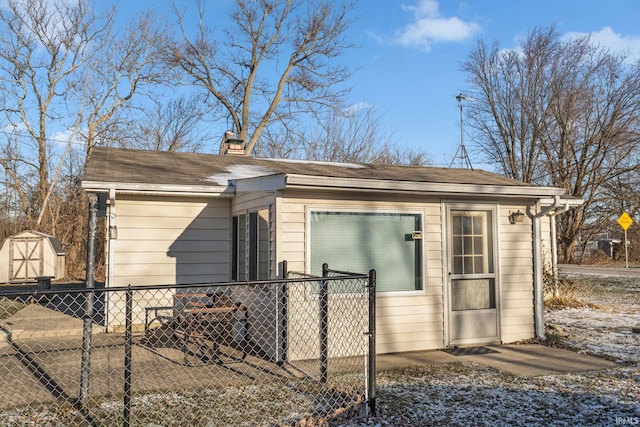 view of property exterior featuring a storage unit