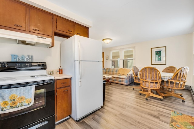 kitchen with light hardwood / wood-style flooring, white fridge, and electric range