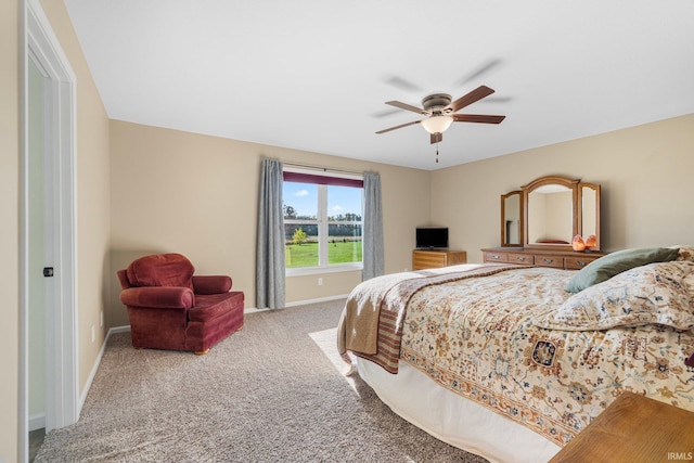 bedroom with ceiling fan and carpet floors