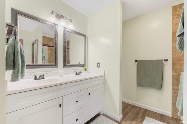 bathroom featuring vanity and wood-type flooring