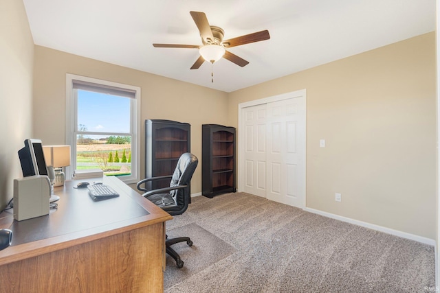 carpeted office with ceiling fan