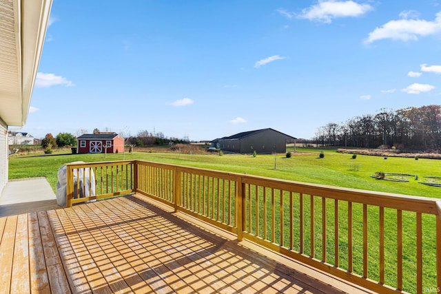 deck featuring a yard and a shed