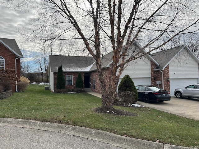 view of front of property featuring a garage and a front yard