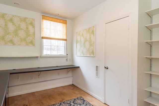 clothes washing area featuring hardwood / wood-style flooring