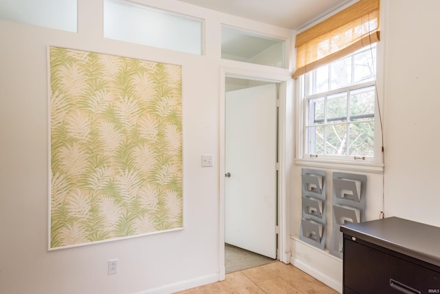 entryway featuring light tile patterned flooring