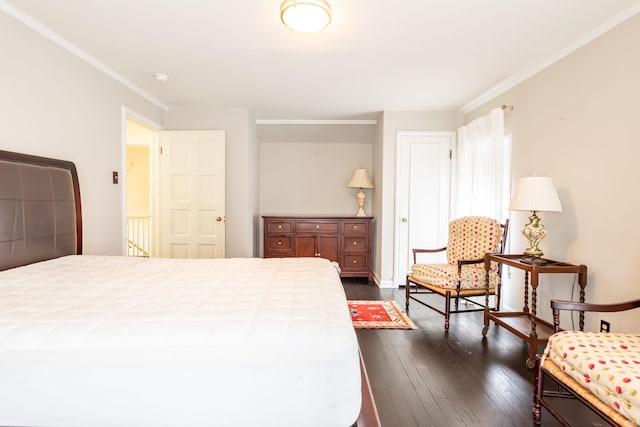 bedroom featuring dark wood-type flooring and crown molding