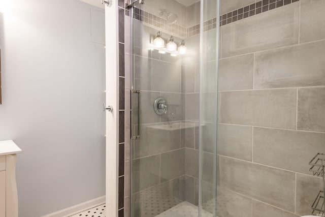 bathroom featuring vanity and an enclosed shower