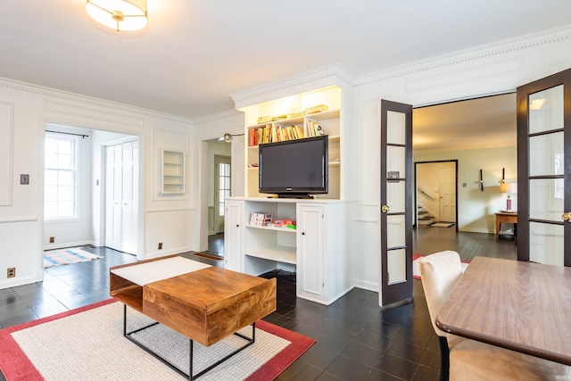 living room with ornamental molding, dark hardwood / wood-style floors, and french doors