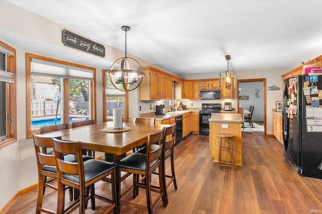 dining room featuring wood-type flooring and sink