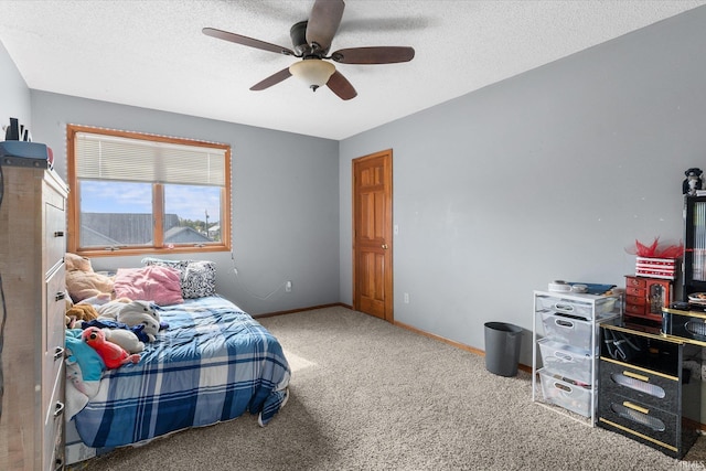 bedroom featuring ceiling fan, carpet flooring, and a textured ceiling