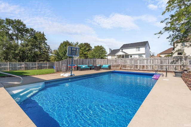 view of pool featuring an outdoor living space and a patio area