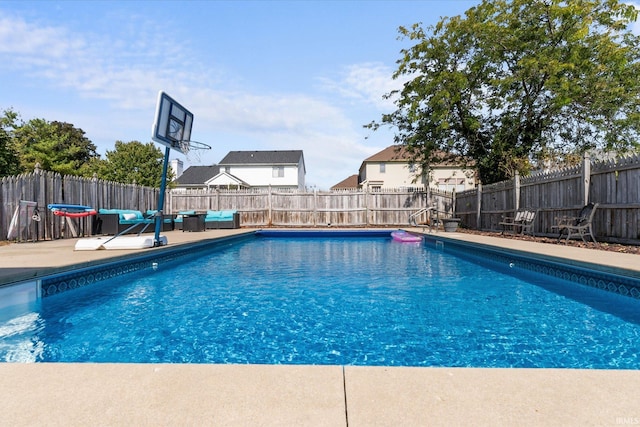 view of swimming pool with a patio area