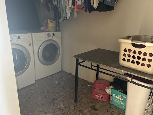 laundry area with separate washer and dryer