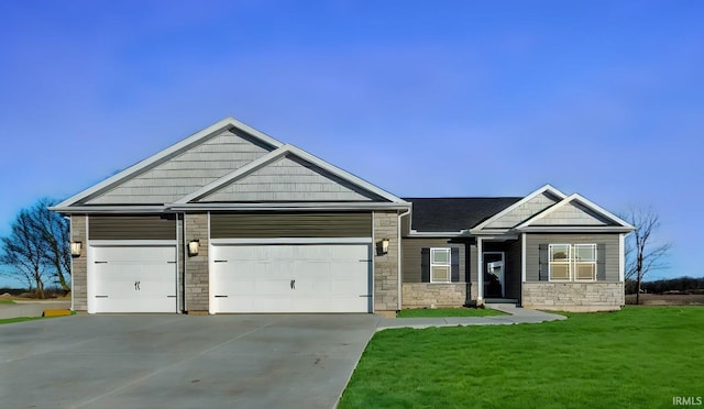 craftsman-style home with a garage and a front yard