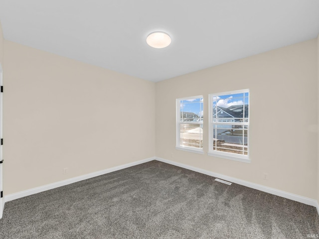 empty room featuring carpet flooring