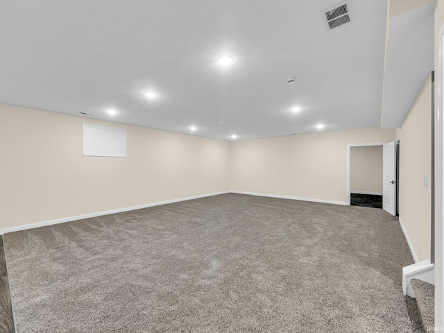 basement featuring dark colored carpet